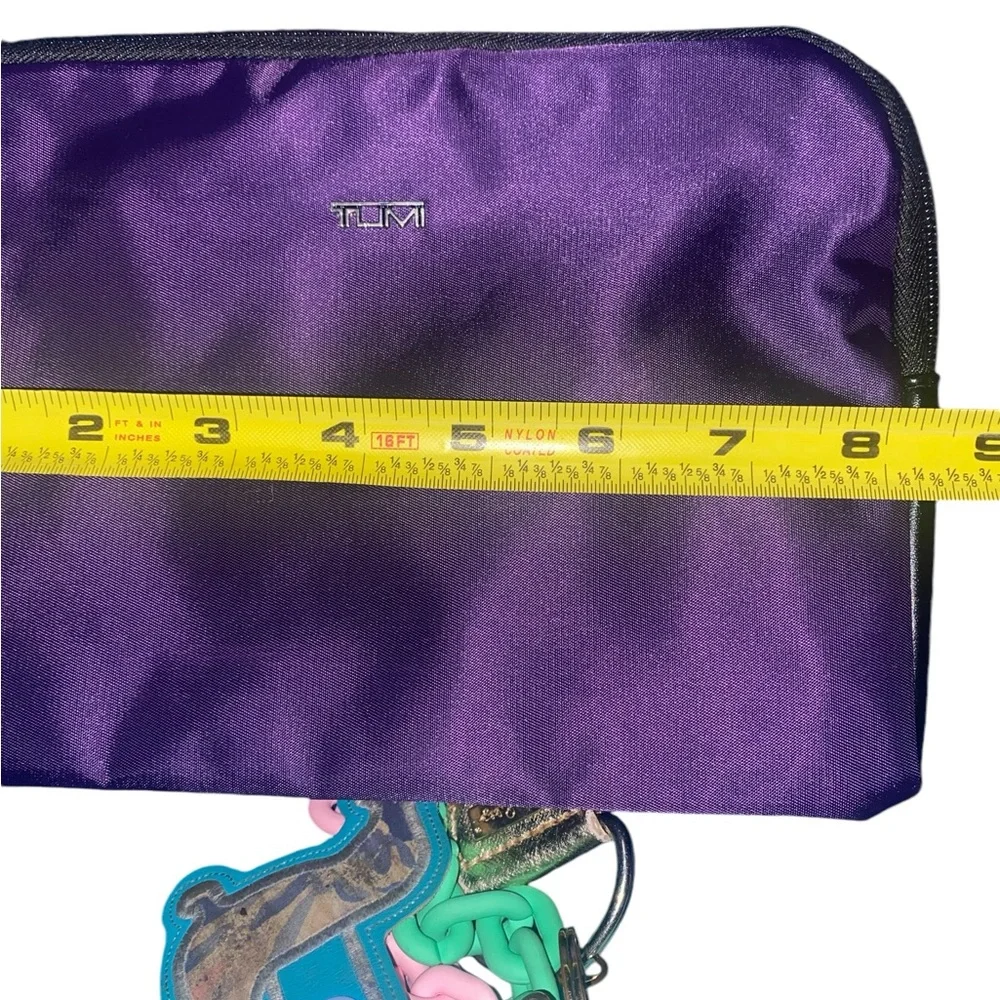 Tumi for delta travel purple bag